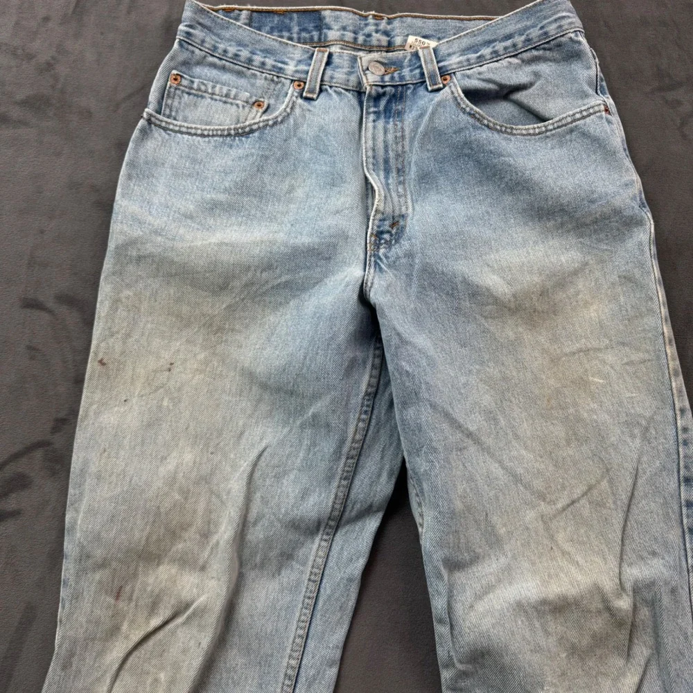 Vintage Levis 550 Relaxed Fit Jeans Light Wash Made in USA 33x34 Distressed